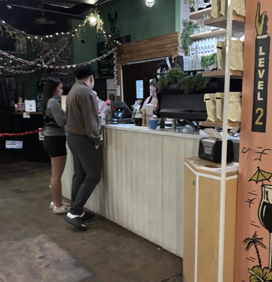 Customers ordering at a local coffee counter